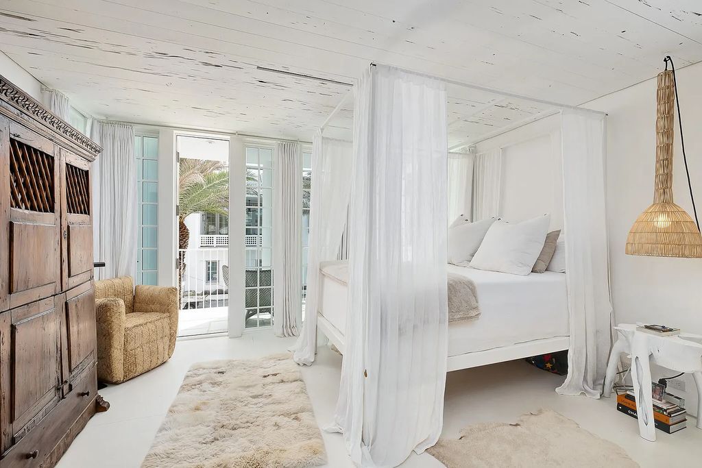 This stunning modernist retreat in the heart of Alys Beach, located at 116 S Charles Street, Inlet Beach, Florida, is a bespoke light-filled home with extraordinary architectural styling and sophisticated interior design.