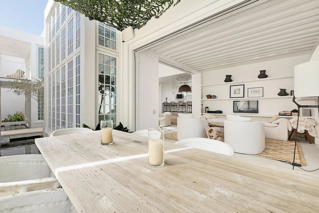 This stunning modernist retreat in the heart of Alys Beach, located at 116 S Charles Street, Inlet Beach, Florida, is a bespoke light-filled home with extraordinary architectural styling and sophisticated interior design.