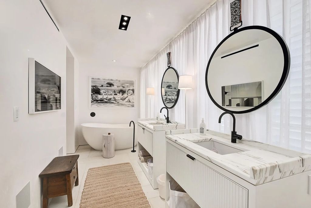 This stunning modernist retreat in the heart of Alys Beach, located at 116 S Charles Street, Inlet Beach, Florida, is a bespoke light-filled home with extraordinary architectural styling and sophisticated interior design.