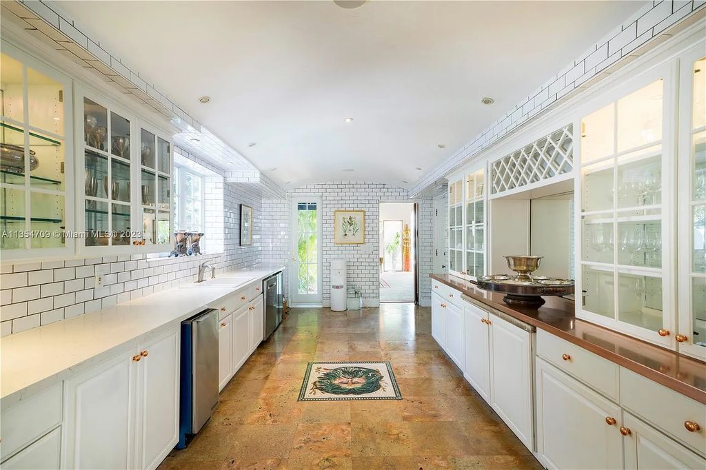 Villa Crono is a stunning Mediterranean-style estate located at 4731 Pine Tree Drive in Miami Beach, Florida. The property features 9 bedrooms, 9 bathrooms, and 9,605 square feet of living space on a rare 42,600 square foot lot with 100 feet of water frontage and no fixed bridges.