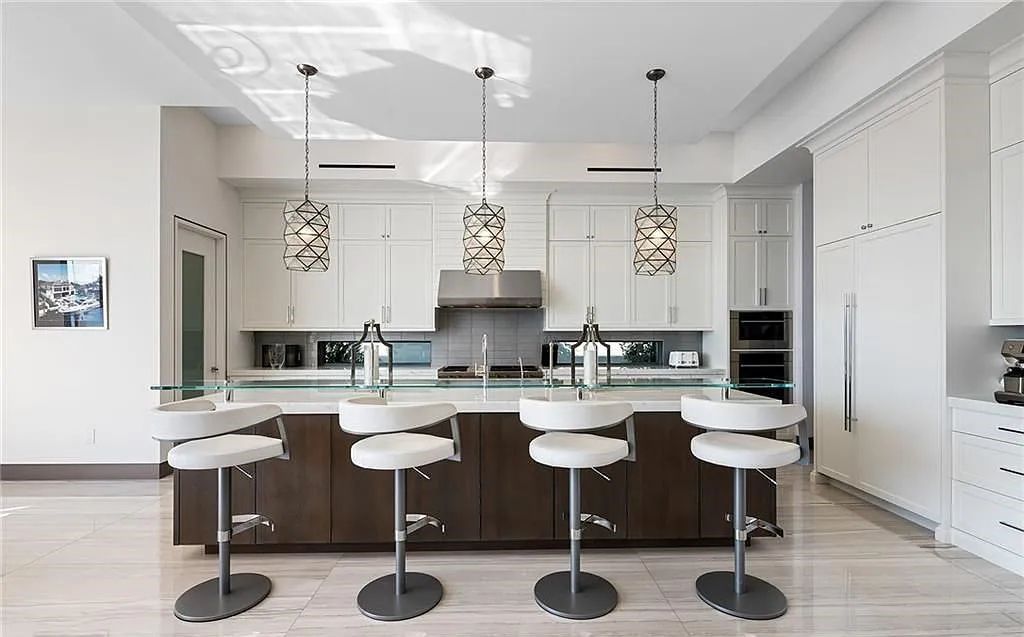 Experience modern coastal living at its finest with 1425 E Lake Drive, a stunning 5-bedroom, 8-bathroom home in prestigious Harbor Beach, Fort Lauderdale, Florida.
