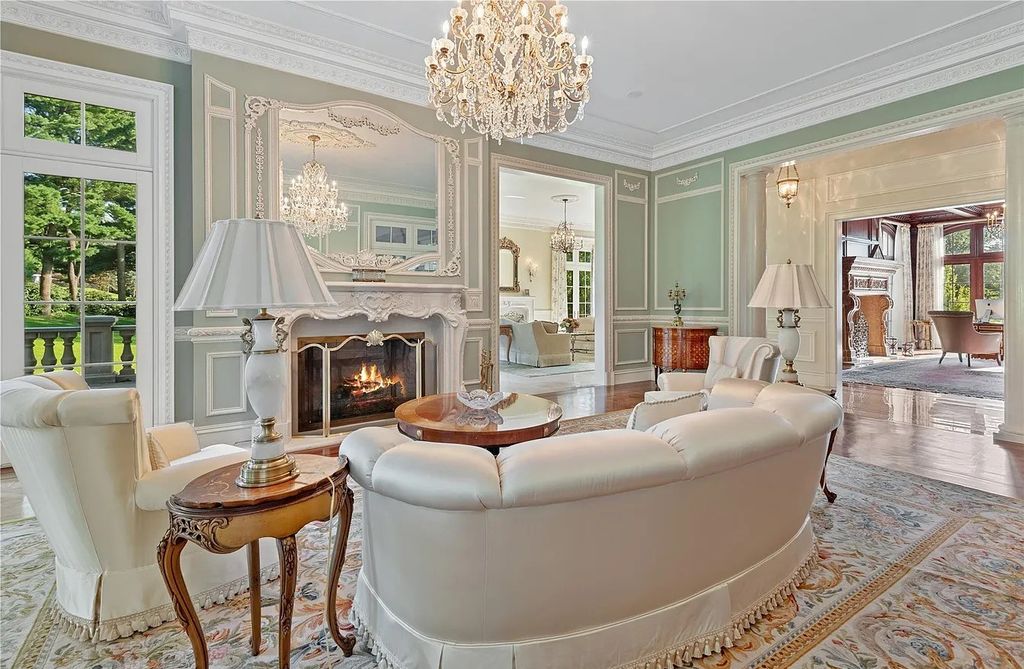 The Property in Mill Neck is a brand new estate complete with indoor pool, elegant pond, state of the art greenhouse and six-car garage, now available for sale. This home located at 102 Horseshoe Road, Mill Neck, New York