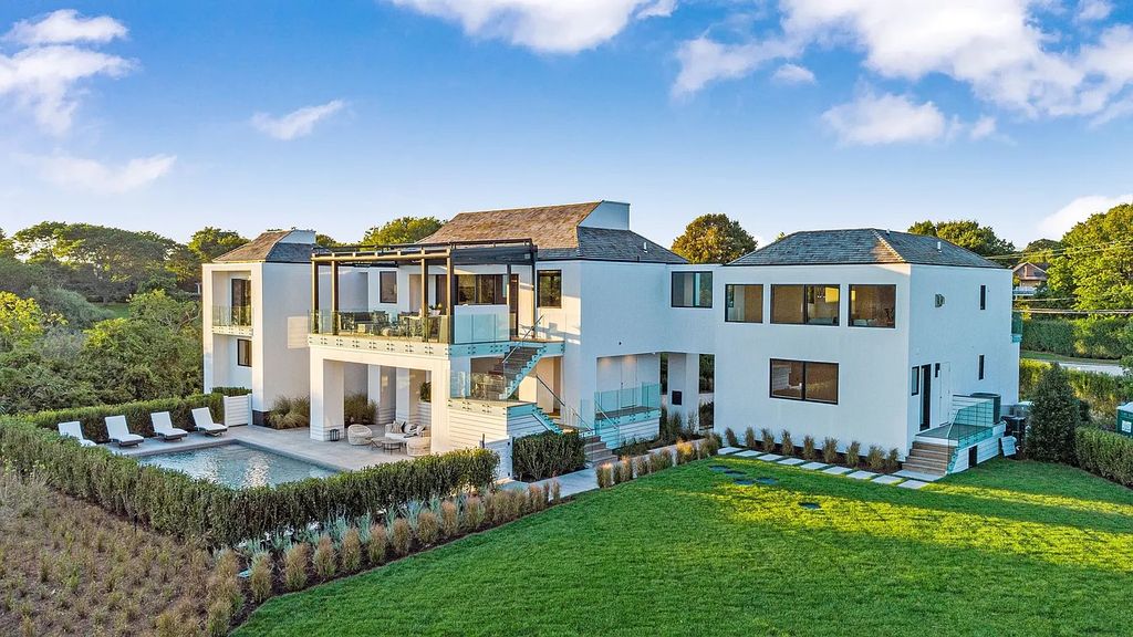 The House in Bridgehampton features an entertainer's floor plan that flows seamlessly into each room with an abundance of natural light, now available for sale. This home located at 1076 Ocean Rd, Bridgehampton, New York