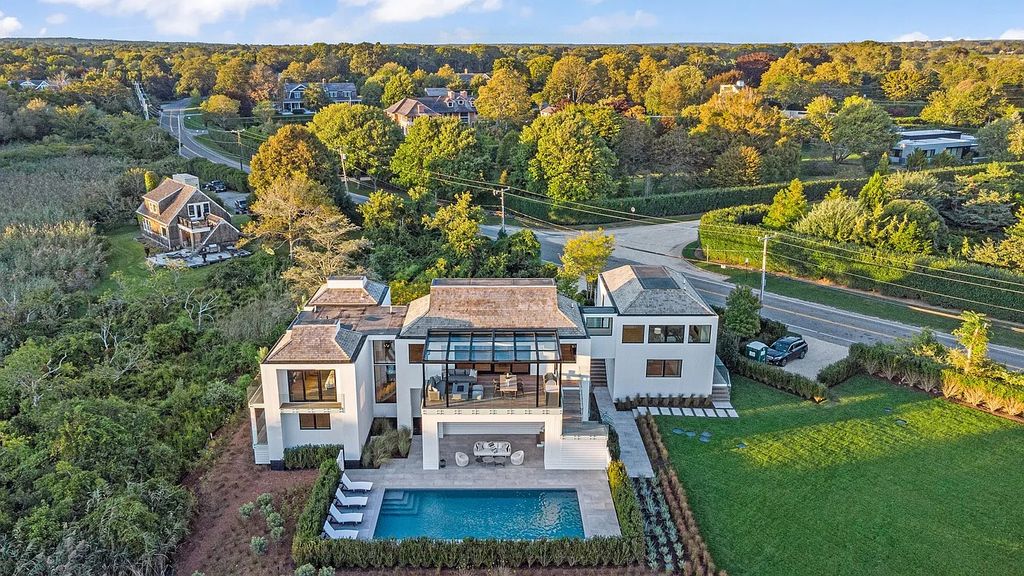 The House in Bridgehampton features an entertainer's floor plan that flows seamlessly into each room with an abundance of natural light, now available for sale. This home located at 1076 Ocean Rd, Bridgehampton, New York