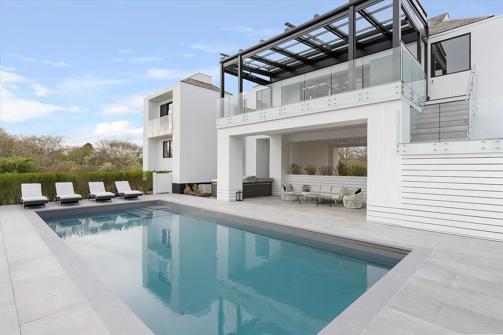 The House in Bridgehampton features an entertainer's floor plan that flows seamlessly into each room with an abundance of natural light, now available for sale. This home located at 1076 Ocean Rd, Bridgehampton, New York