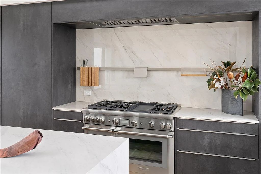 The House in Bridgehampton features an entertainer's floor plan that flows seamlessly into each room with an abundance of natural light, now available for sale. This home located at 1076 Ocean Rd, Bridgehampton, New York