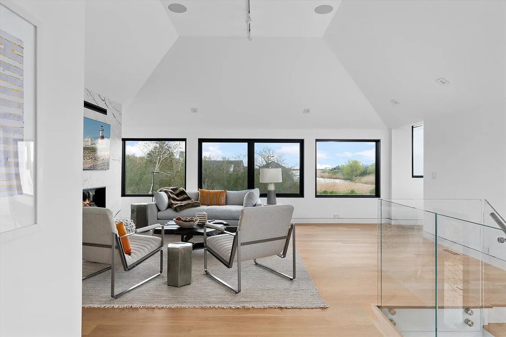 The House in Bridgehampton features an entertainer's floor plan that flows seamlessly into each room with an abundance of natural light, now available for sale. This home located at 1076 Ocean Rd, Bridgehampton, New York