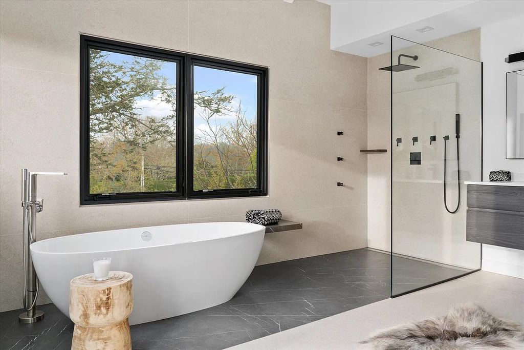 The House in Bridgehampton features an entertainer's floor plan that flows seamlessly into each room with an abundance of natural light, now available for sale. This home located at 1076 Ocean Rd, Bridgehampton, New York