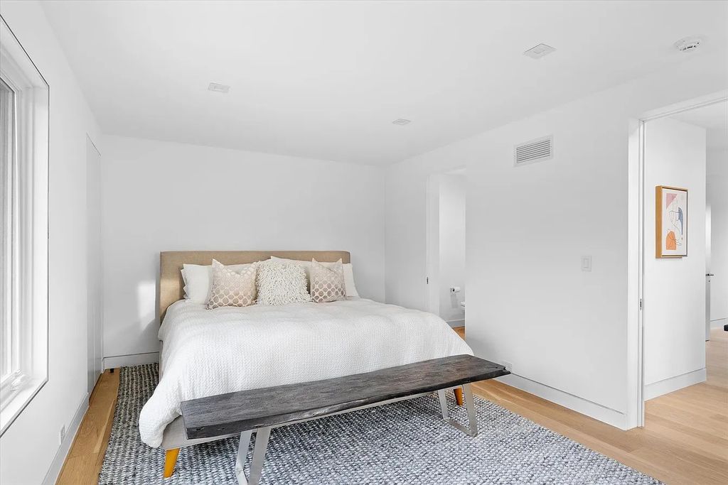 The House in Bridgehampton features an entertainer's floor plan that flows seamlessly into each room with an abundance of natural light, now available for sale. This home located at 1076 Ocean Rd, Bridgehampton, New York