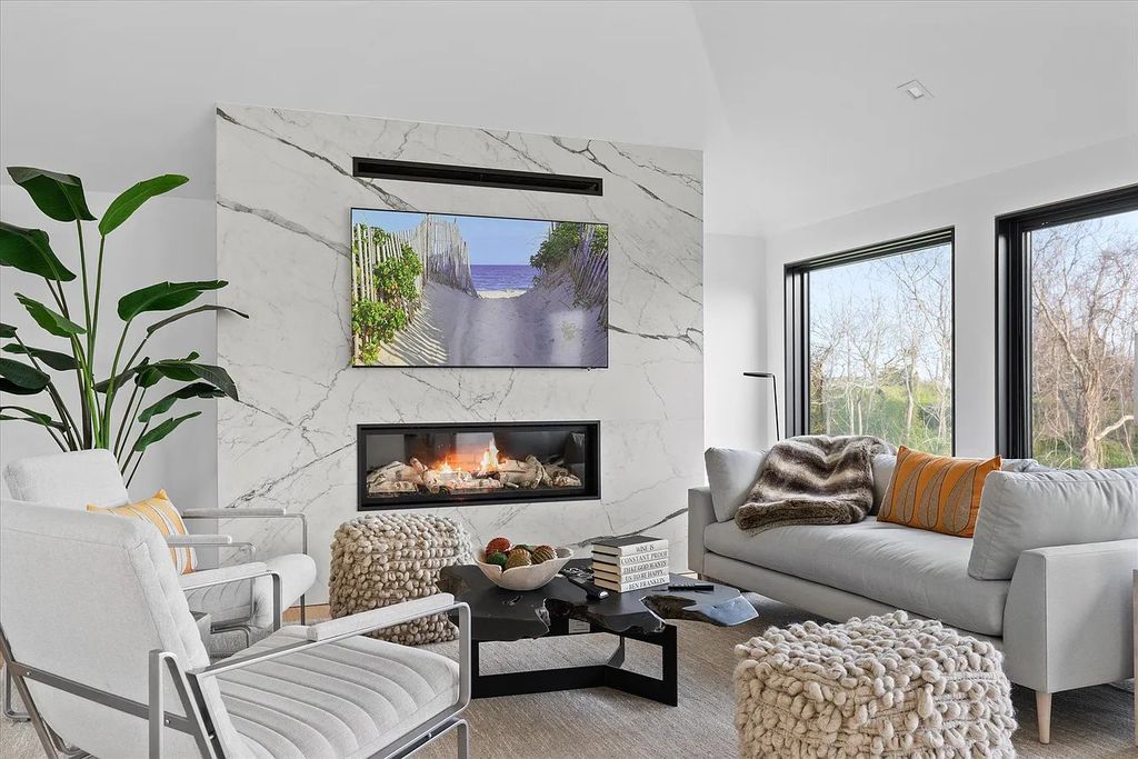 The House in Bridgehampton features an entertainer's floor plan that flows seamlessly into each room with an abundance of natural light, now available for sale. This home located at 1076 Ocean Rd, Bridgehampton, New York
