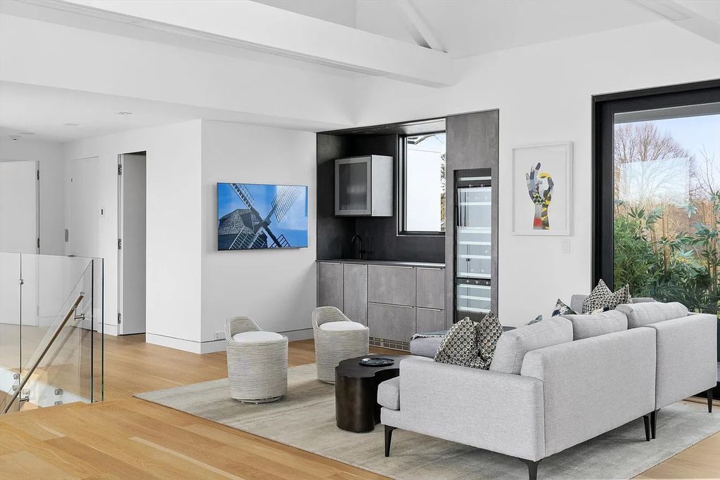 The House in Bridgehampton features an entertainer's floor plan that flows seamlessly into each room with an abundance of natural light, now available for sale. This home located at 1076 Ocean Rd, Bridgehampton, New York