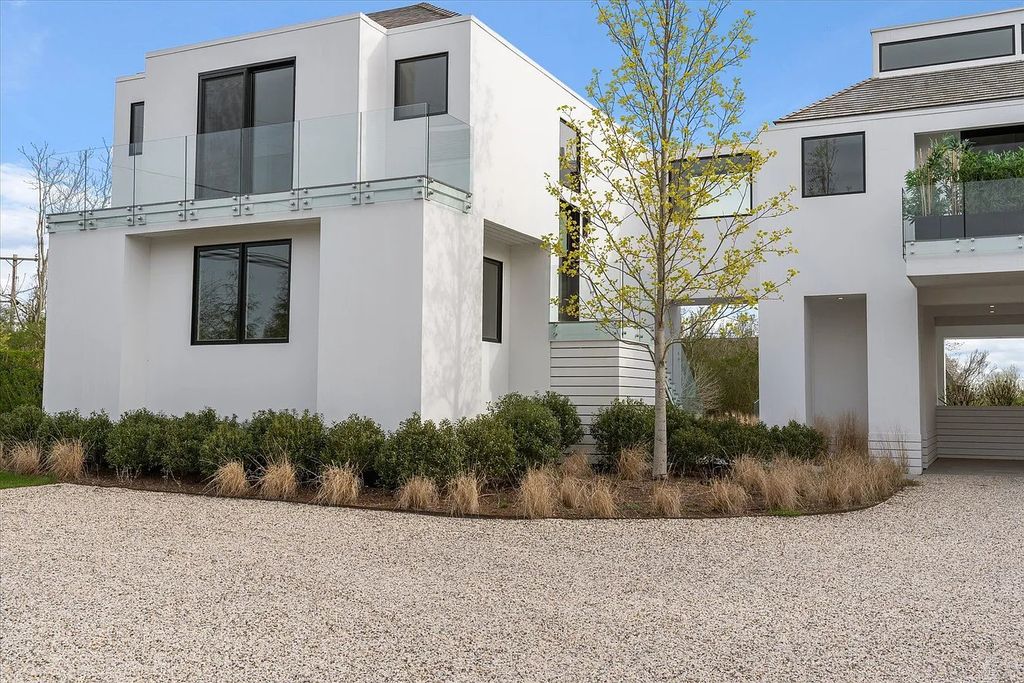 The House in Bridgehampton features an entertainer's floor plan that flows seamlessly into each room with an abundance of natural light, now available for sale. This home located at 1076 Ocean Rd, Bridgehampton, New York