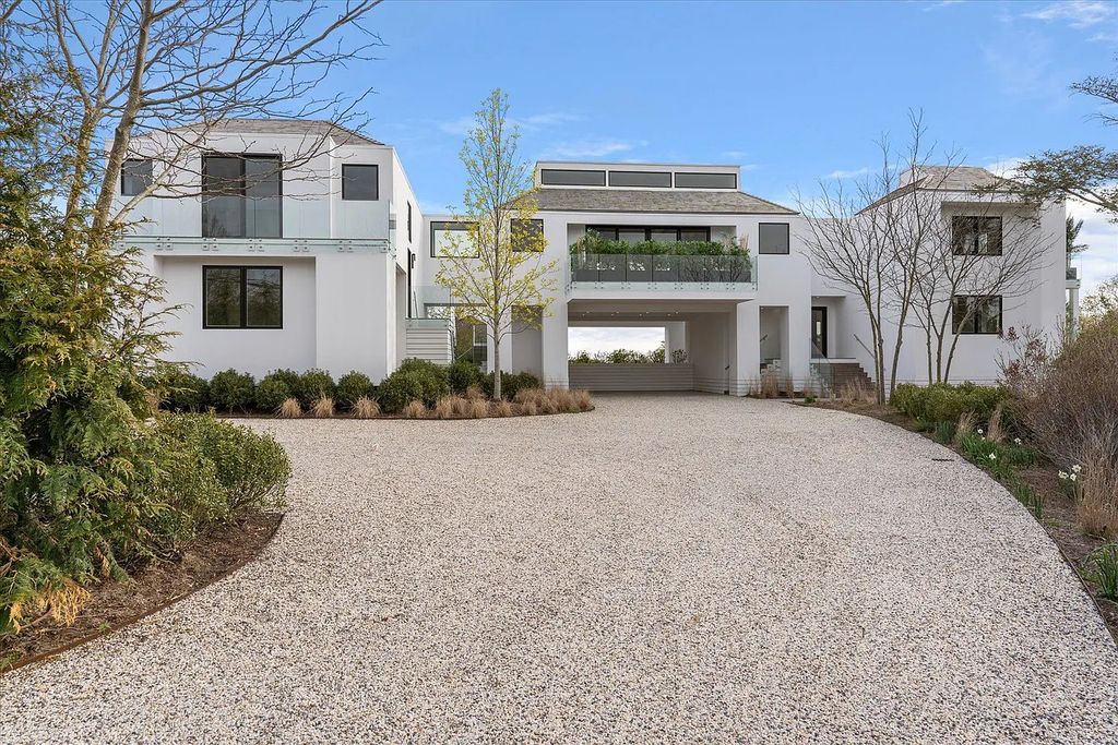 The House in Bridgehampton features an entertainer's floor plan that flows seamlessly into each room with an abundance of natural light, now available for sale. This home located at 1076 Ocean Rd, Bridgehampton, New York