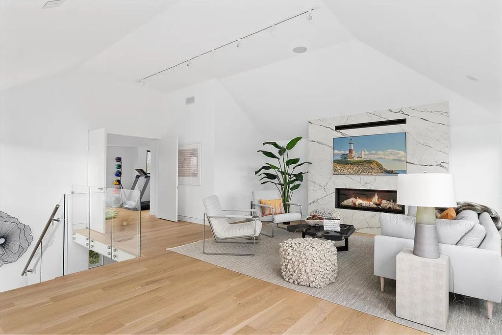 The House in Bridgehampton features an entertainer's floor plan that flows seamlessly into each room with an abundance of natural light, now available for sale. This home located at 1076 Ocean Rd, Bridgehampton, New York