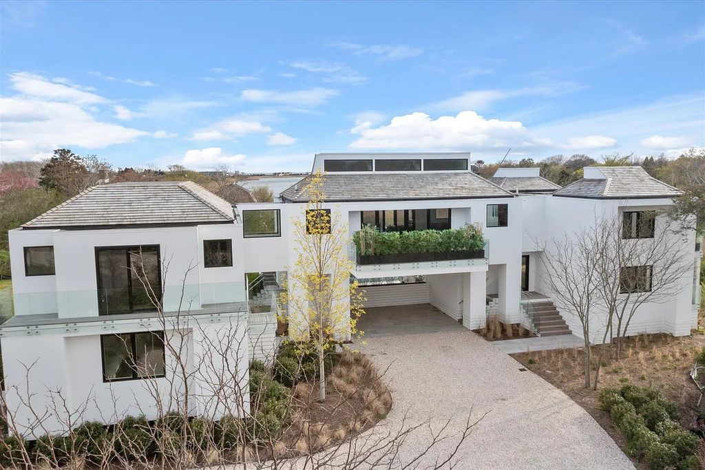 The House in Bridgehampton features an entertainer's floor plan that flows seamlessly into each room with an abundance of natural light, now available for sale. This home located at 1076 Ocean Rd, Bridgehampton, New York