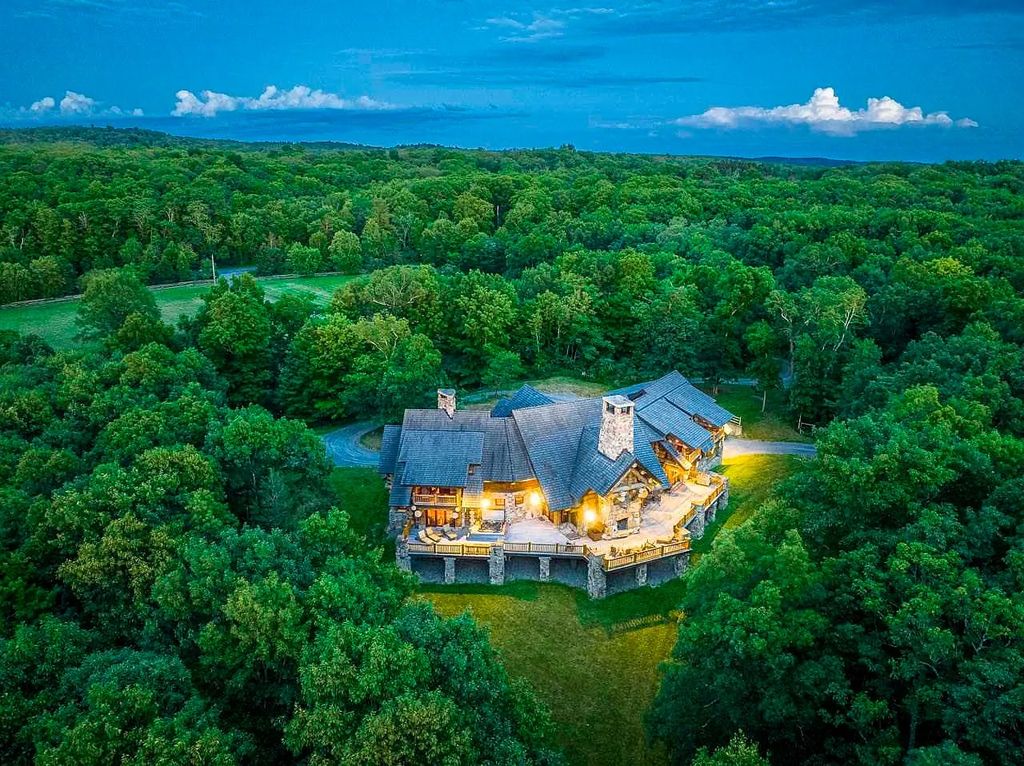 The Home in Millbrook is constructed of standing dead timber from the west and immense stone from Pennsylvania, now available for sale. This home located at 521 Stanford Rd, Millbrook, New York