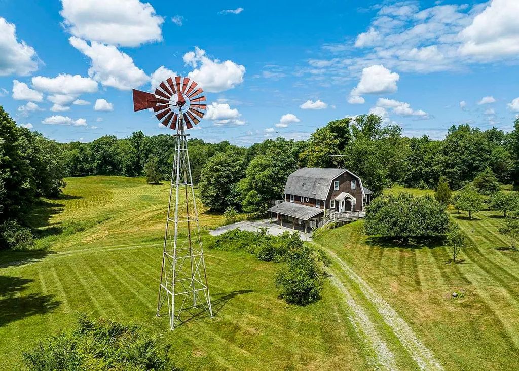 The Home in Millbrook is constructed of standing dead timber from the west and immense stone from Pennsylvania, now available for sale. This home located at 521 Stanford Rd, Millbrook, New York
