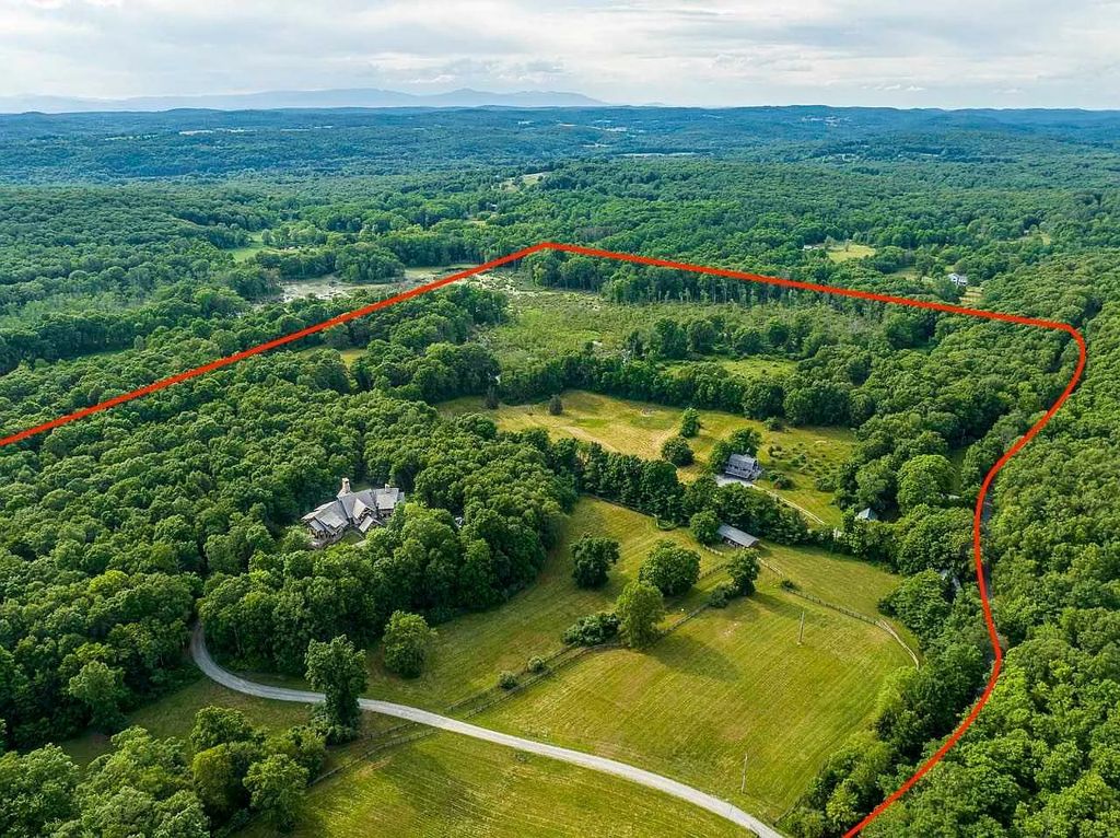 The Home in Millbrook is constructed of standing dead timber from the west and immense stone from Pennsylvania, now available for sale. This home located at 521 Stanford Rd, Millbrook, New York