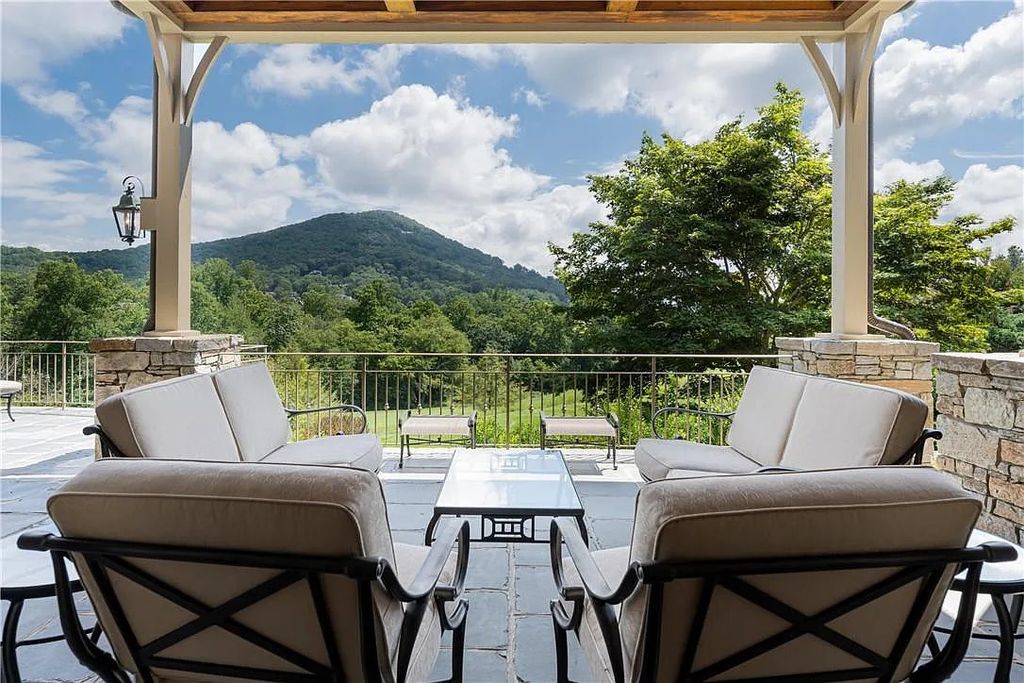 The Estate in Arden offers superb architectural features and radiates timeless elegance, now available for sale. This home located at 1322 Fawn Meadow Way, Arden, North Carolina
