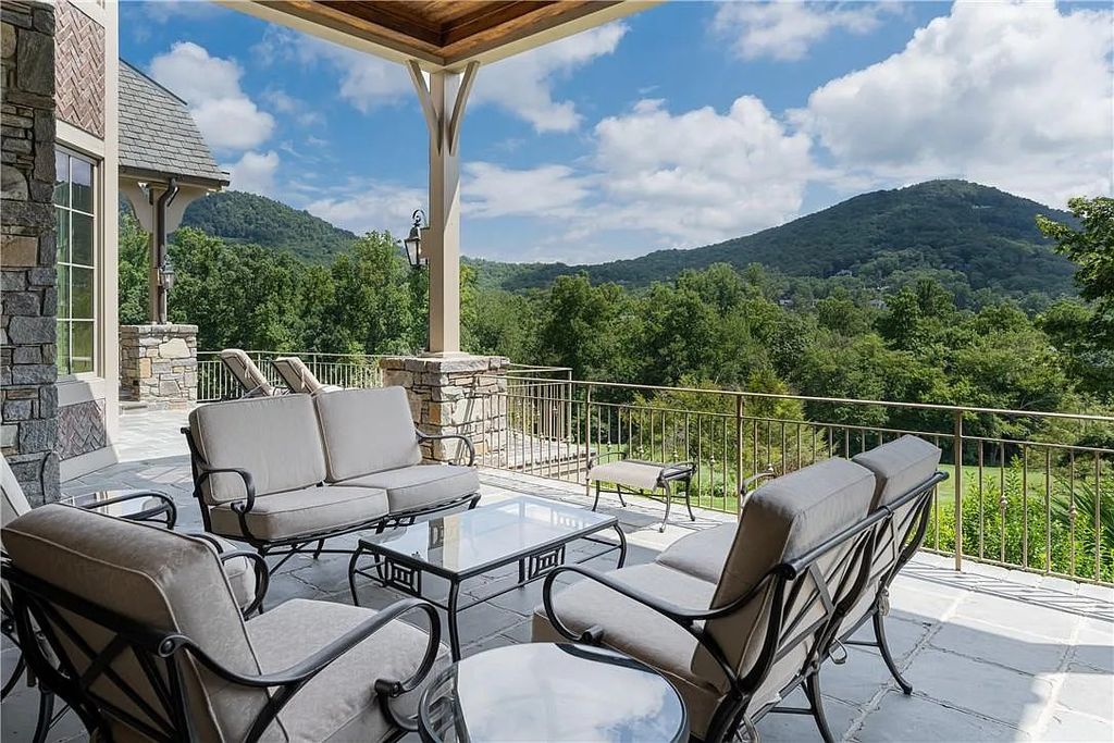 The Estate in Arden offers superb architectural features and radiates timeless elegance, now available for sale. This home located at 1322 Fawn Meadow Way, Arden, North Carolina