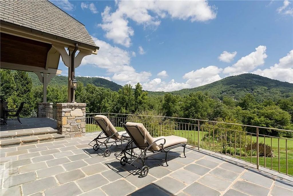 The Estate in Arden offers superb architectural features and radiates timeless elegance, now available for sale. This home located at 1322 Fawn Meadow Way, Arden, North Carolina