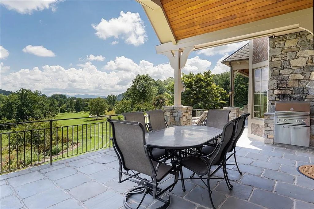 The Estate in Arden offers superb architectural features and radiates timeless elegance, now available for sale. This home located at 1322 Fawn Meadow Way, Arden, North Carolina