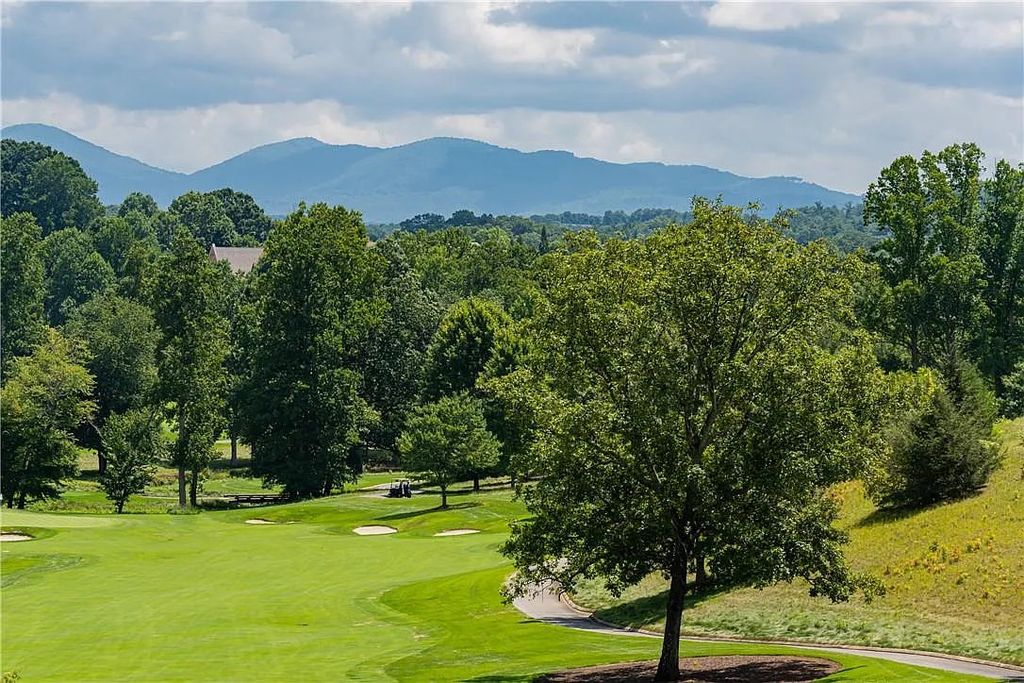 The Estate in Arden offers superb architectural features and radiates timeless elegance, now available for sale. This home located at 1322 Fawn Meadow Way, Arden, North Carolina