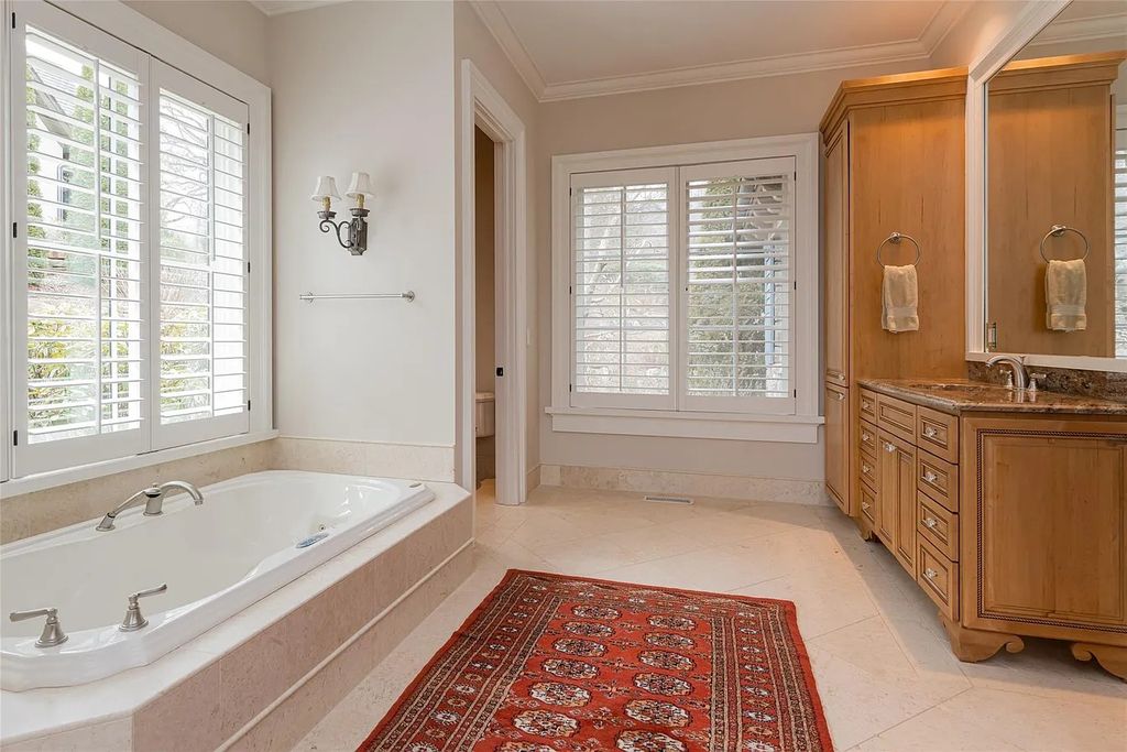 The Estate in Arden offers superb architectural features and radiates timeless elegance, now available for sale. This home located at 1322 Fawn Meadow Way, Arden, North Carolina
