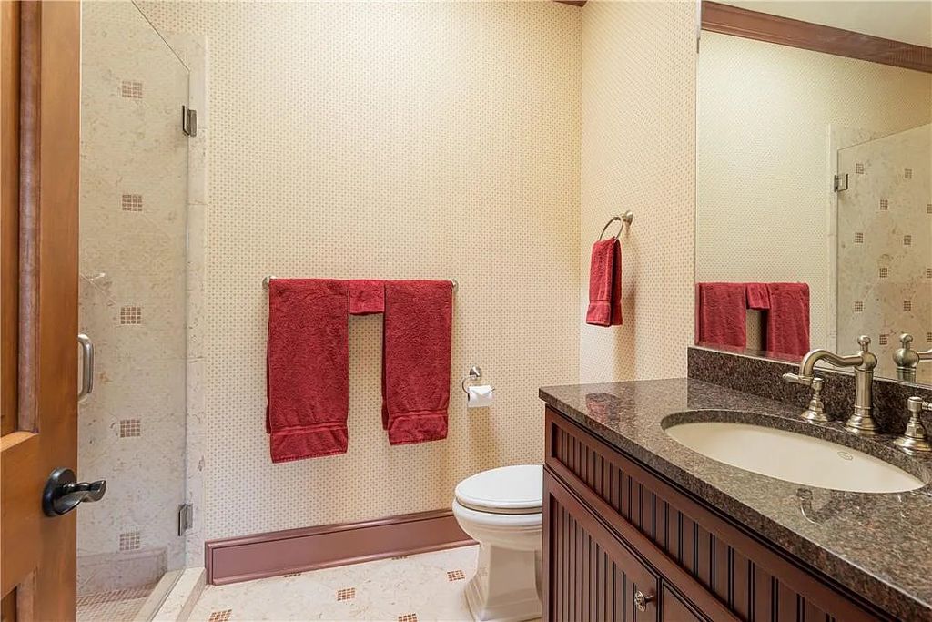 The Estate in Arden offers superb architectural features and radiates timeless elegance, now available for sale. This home located at 1322 Fawn Meadow Way, Arden, North Carolina