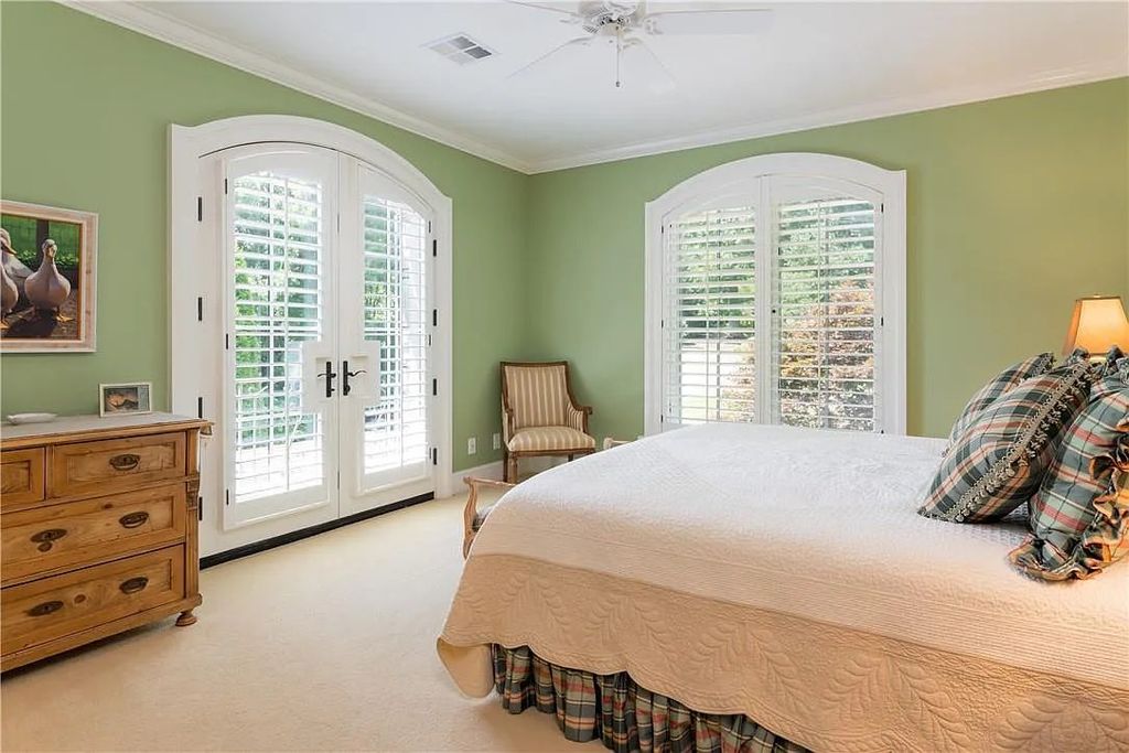 The Estate in Arden offers superb architectural features and radiates timeless elegance, now available for sale. This home located at 1322 Fawn Meadow Way, Arden, North Carolina