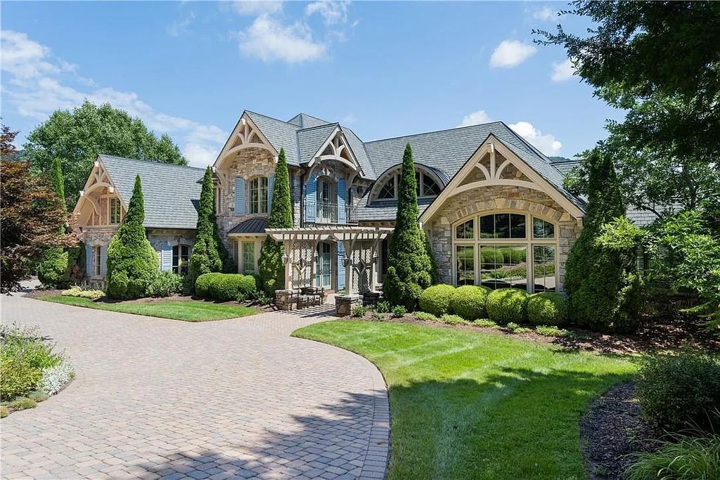 The Estate in Arden offers superb architectural features and radiates timeless elegance, now available for sale. This home located at 1322 Fawn Meadow Way, Arden, North Carolina