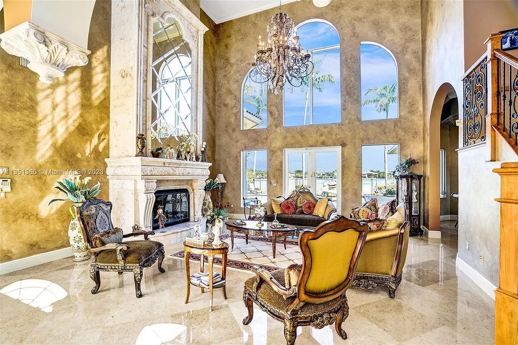 3308 Islewood Avenue, Weston, Florida is located in the prestigious gated community of Windmill Reserve, and it offers luxurious living on a grand scale. Situated on a premium lake lot with a lushly landscaped yard, this home in Weston features a gas-heated pool/spa, covered summer kitchen, Chicago brick patio, and roll-down shades, making it perfect for entertaining guests or enjoying time with family.