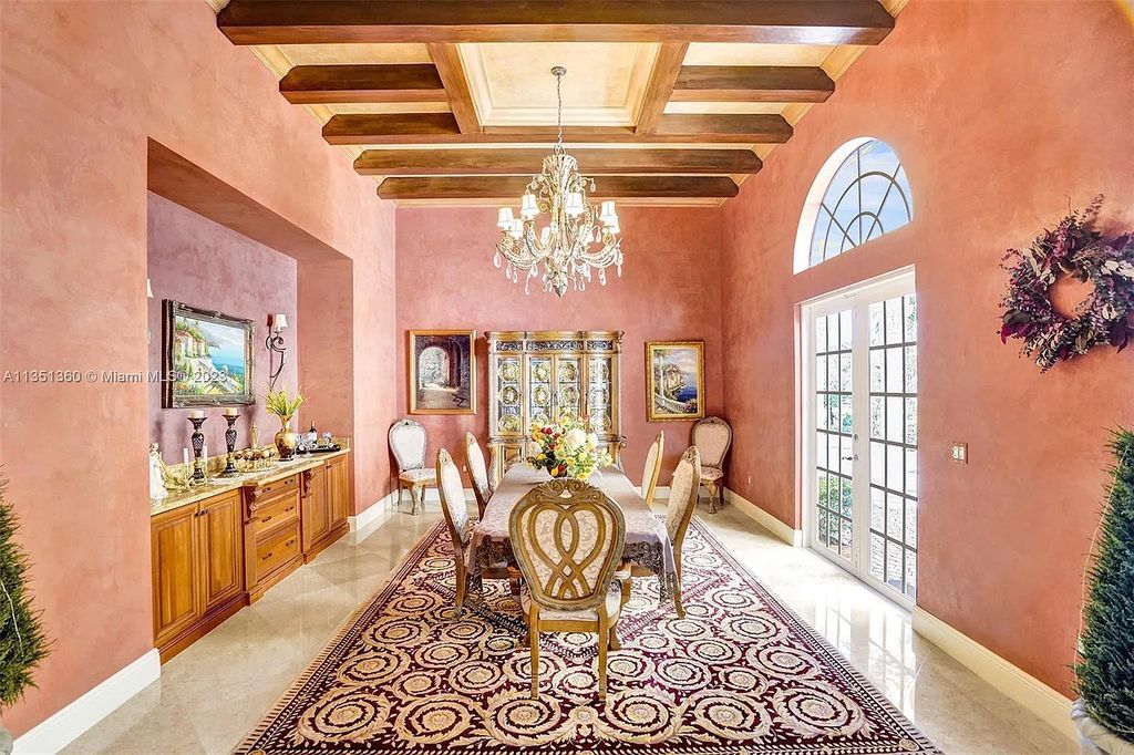 3308 Islewood Avenue, Weston, Florida is located in the prestigious gated community of Windmill Reserve, and it offers luxurious living on a grand scale. Situated on a premium lake lot with a lushly landscaped yard, this home in Weston features a gas-heated pool/spa, covered summer kitchen, Chicago brick patio, and roll-down shades, making it perfect for entertaining guests or enjoying time with family.