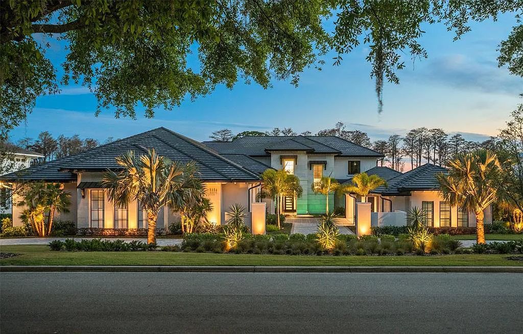 This luxurious lakefront mansion at 9306 Blanche Cove Drive in Windermere, Florida, is a custom-crafted masterpiece built for the ultimate sports enthusiast. The 5-bedroom, 8-bath home spans 14,856 square feet and includes a 6,060 square foot air-conditioned full-sized basketball court, a theater, an exercise room with sauna, and a two-story master closet.