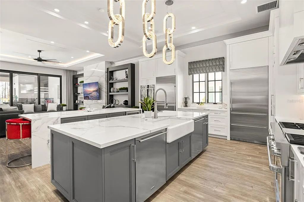 This luxurious lakefront mansion at 9306 Blanche Cove Drive in Windermere, Florida, is a custom-crafted masterpiece built for the ultimate sports enthusiast. The 5-bedroom, 8-bath home spans 14,856 square feet and includes a 6,060 square foot air-conditioned full-sized basketball court, a theater, an exercise room with sauna, and a two-story master closet.