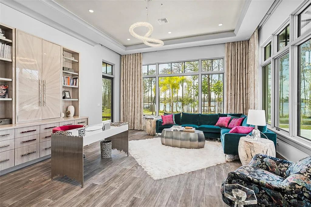This luxurious lakefront mansion at 9306 Blanche Cove Drive in Windermere, Florida, is a custom-crafted masterpiece built for the ultimate sports enthusiast. The 5-bedroom, 8-bath home spans 14,856 square feet and includes a 6,060 square foot air-conditioned full-sized basketball court, a theater, an exercise room with sauna, and a two-story master closet.
