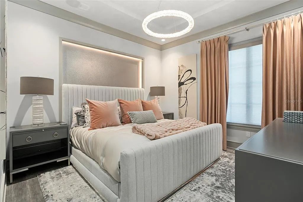 This luxurious lakefront mansion at 9306 Blanche Cove Drive in Windermere, Florida, is a custom-crafted masterpiece built for the ultimate sports enthusiast. The 5-bedroom, 8-bath home spans 14,856 square feet and includes a 6,060 square foot air-conditioned full-sized basketball court, a theater, an exercise room with sauna, and a two-story master closet.