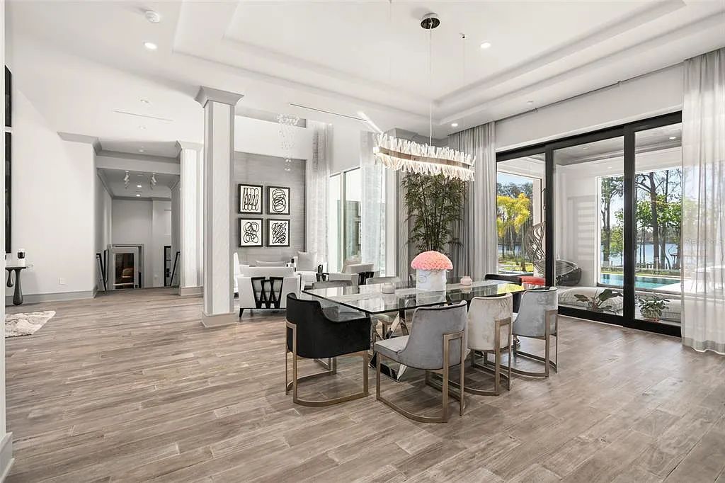 This luxurious lakefront mansion at 9306 Blanche Cove Drive in Windermere, Florida, is a custom-crafted masterpiece built for the ultimate sports enthusiast. The 5-bedroom, 8-bath home spans 14,856 square feet and includes a 6,060 square foot air-conditioned full-sized basketball court, a theater, an exercise room with sauna, and a two-story master closet.