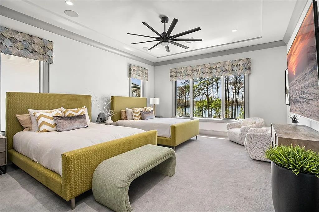 This luxurious lakefront mansion at 9306 Blanche Cove Drive in Windermere, Florida, is a custom-crafted masterpiece built for the ultimate sports enthusiast. The 5-bedroom, 8-bath home spans 14,856 square feet and includes a 6,060 square foot air-conditioned full-sized basketball court, a theater, an exercise room with sauna, and a two-story master closet.