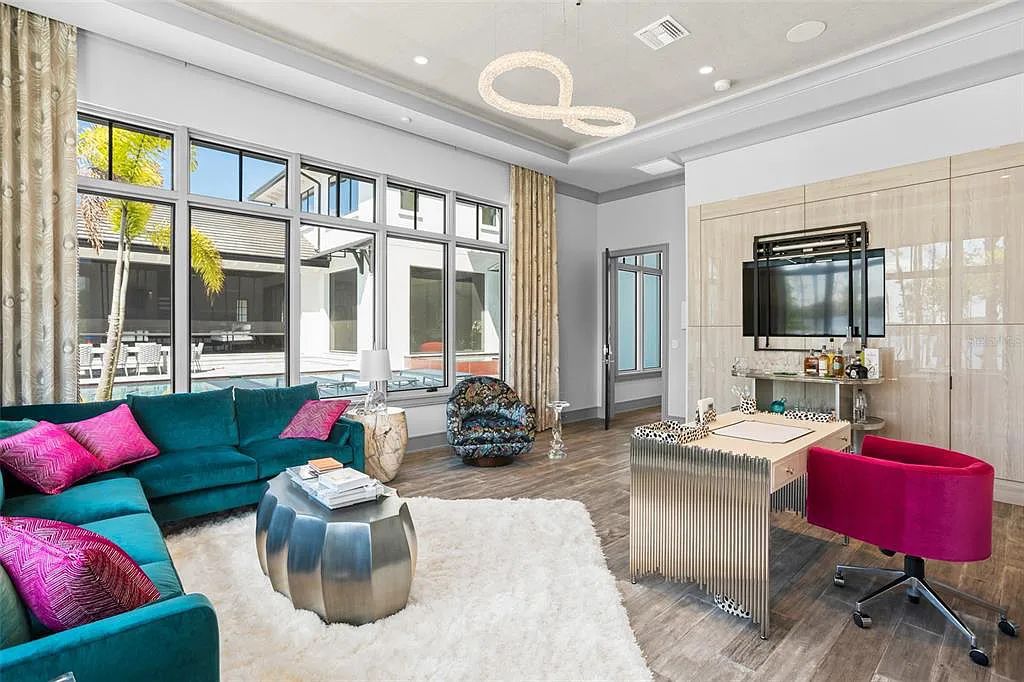This luxurious lakefront mansion at 9306 Blanche Cove Drive in Windermere, Florida, is a custom-crafted masterpiece built for the ultimate sports enthusiast. The 5-bedroom, 8-bath home spans 14,856 square feet and includes a 6,060 square foot air-conditioned full-sized basketball court, a theater, an exercise room with sauna, and a two-story master closet.