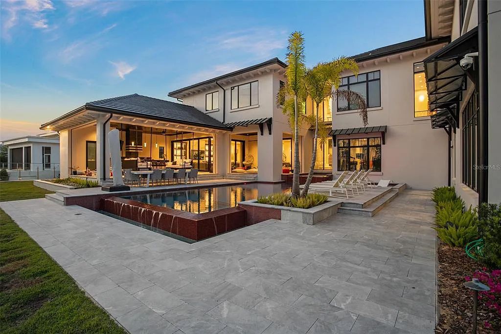 This luxurious lakefront mansion at 9306 Blanche Cove Drive in Windermere, Florida, is a custom-crafted masterpiece built for the ultimate sports enthusiast. The 5-bedroom, 8-bath home spans 14,856 square feet and includes a 6,060 square foot air-conditioned full-sized basketball court, a theater, an exercise room with sauna, and a two-story master closet.