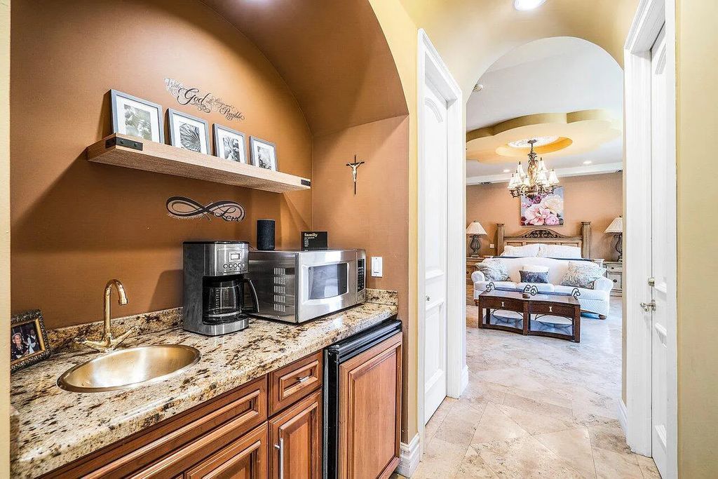 Introducing a stunning house at 14 E Ocean Avenue, located in the highly sought-after area of Boynton Beach, Florida. This luxurious property boasts 6 spacious bedrooms and 7 modern bathrooms, perfect for accommodating large families or hosting guests.