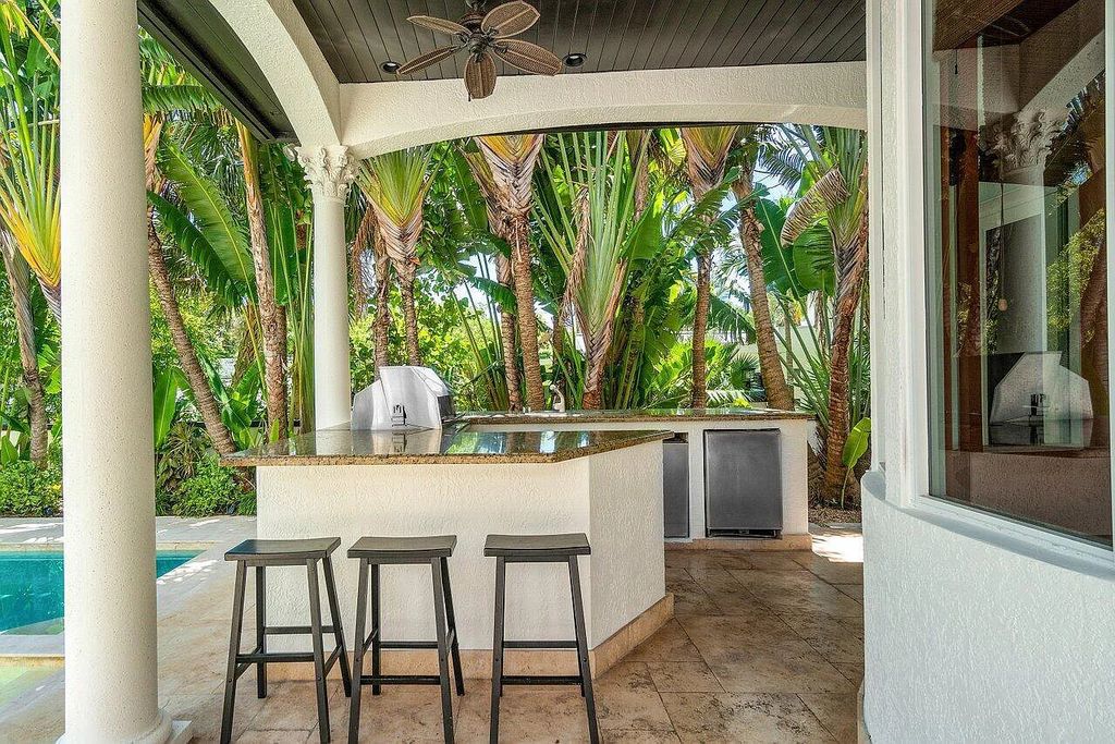 Introducing a stunning house at 14 E Ocean Avenue, located in the highly sought-after area of Boynton Beach, Florida. This luxurious property boasts 6 spacious bedrooms and 7 modern bathrooms, perfect for accommodating large families or hosting guests.
