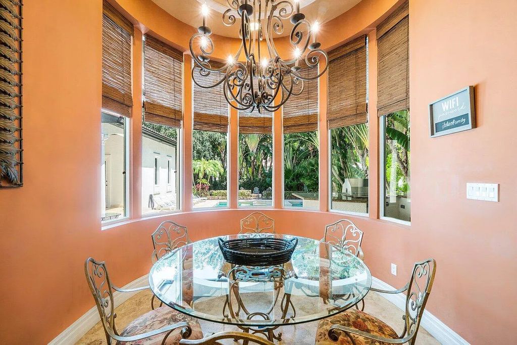 Introducing a stunning house at 14 E Ocean Avenue, located in the highly sought-after area of Boynton Beach, Florida. This luxurious property boasts 6 spacious bedrooms and 7 modern bathrooms, perfect for accommodating large families or hosting guests.