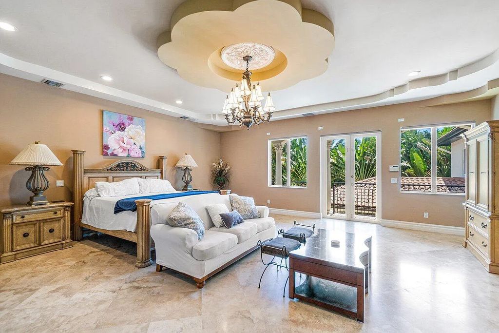 Introducing a stunning house at 14 E Ocean Avenue, located in the highly sought-after area of Boynton Beach, Florida. This luxurious property boasts 6 spacious bedrooms and 7 modern bathrooms, perfect for accommodating large families or hosting guests.