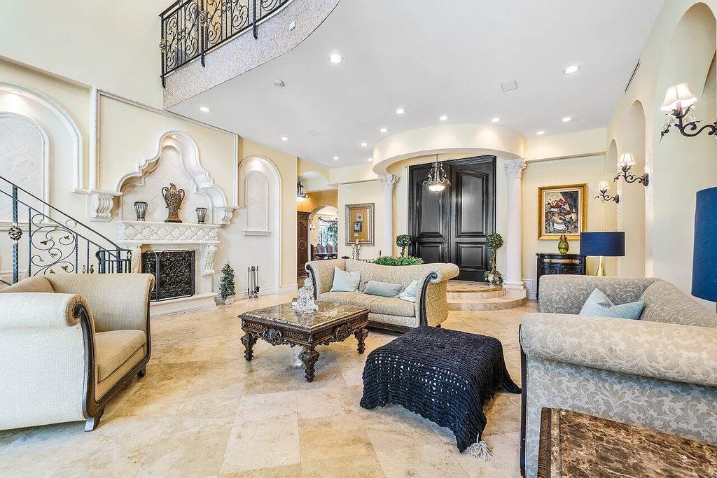 Introducing a stunning house at 14 E Ocean Avenue, located in the highly sought-after area of Boynton Beach, Florida. This luxurious property boasts 6 spacious bedrooms and 7 modern bathrooms, perfect for accommodating large families or hosting guests.