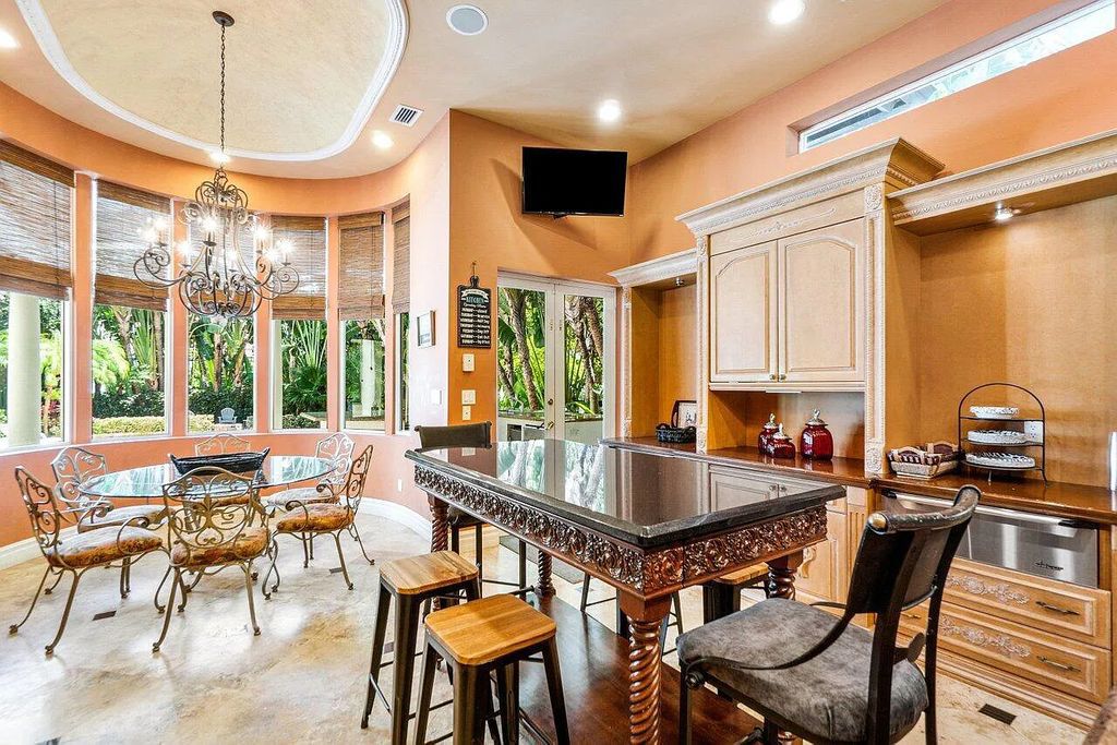 Introducing a stunning house at 14 E Ocean Avenue, located in the highly sought-after area of Boynton Beach, Florida. This luxurious property boasts 6 spacious bedrooms and 7 modern bathrooms, perfect for accommodating large families or hosting guests.