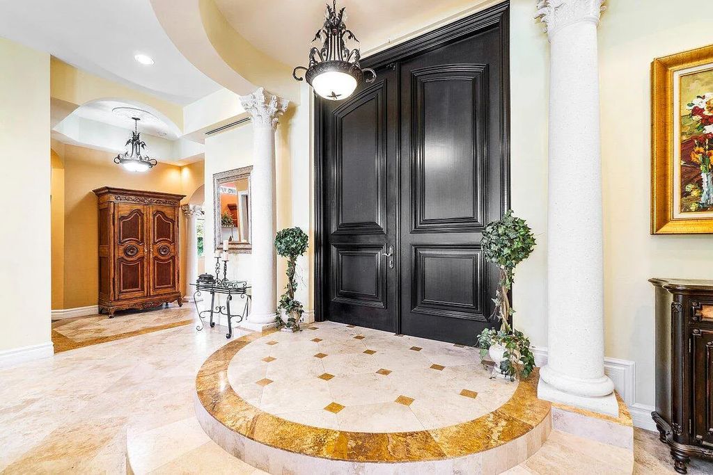 Introducing a stunning house at 14 E Ocean Avenue, located in the highly sought-after area of Boynton Beach, Florida. This luxurious property boasts 6 spacious bedrooms and 7 modern bathrooms, perfect for accommodating large families or hosting guests.