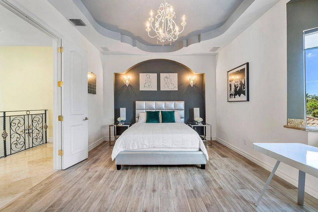 Introducing a stunning house at 14 E Ocean Avenue, located in the highly sought-after area of Boynton Beach, Florida. This luxurious property boasts 6 spacious bedrooms and 7 modern bathrooms, perfect for accommodating large families or hosting guests.