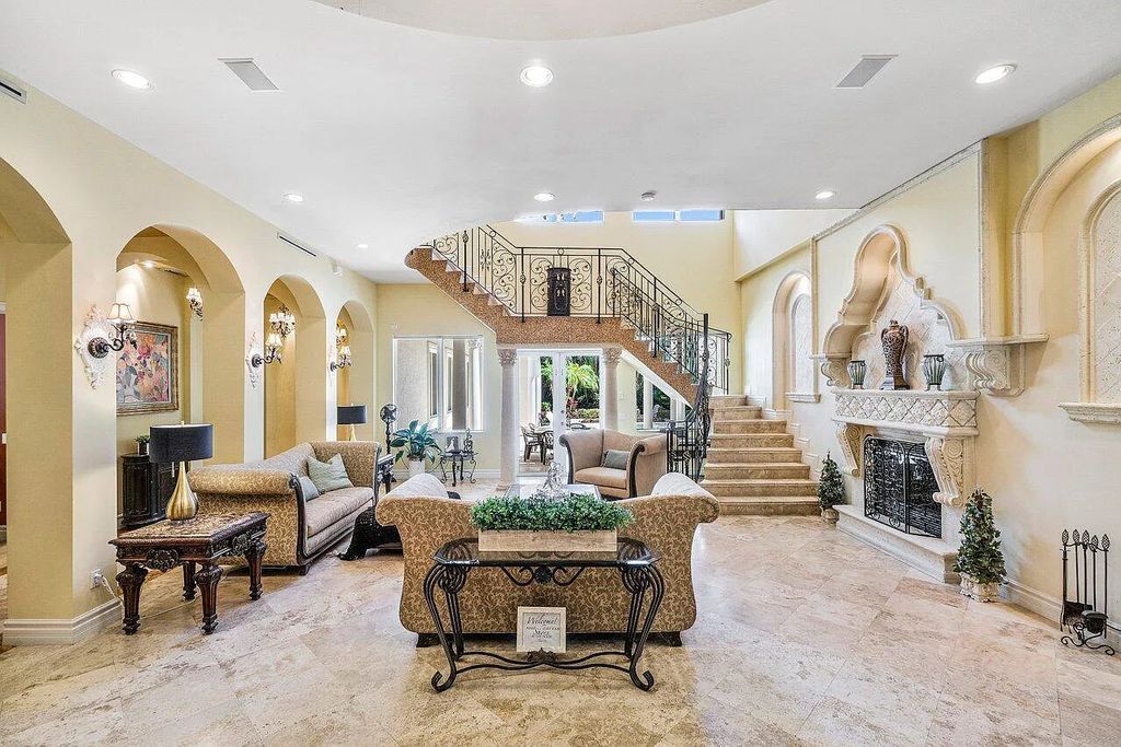 Introducing a stunning house at 14 E Ocean Avenue, located in the highly sought-after area of Boynton Beach, Florida. This luxurious property boasts 6 spacious bedrooms and 7 modern bathrooms, perfect for accommodating large families or hosting guests.